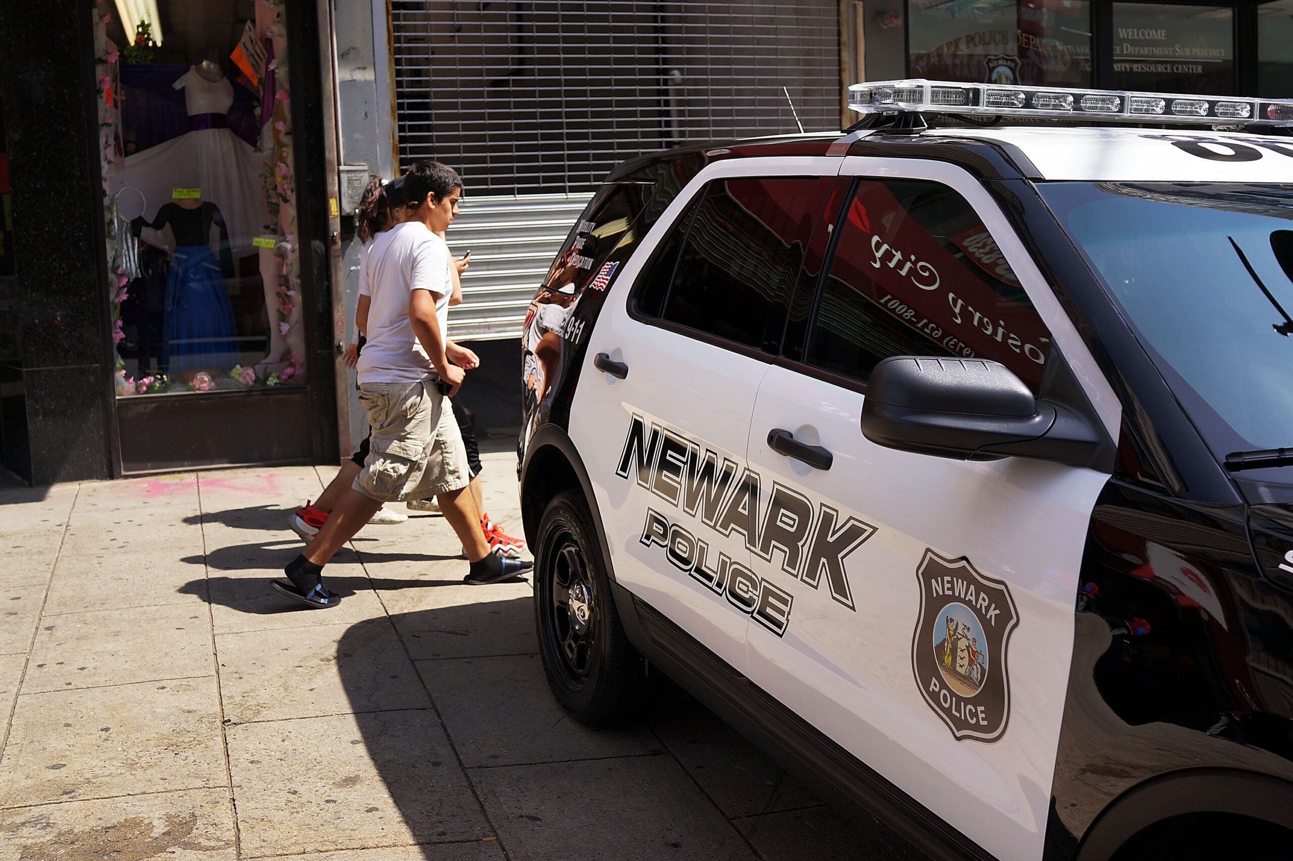 A police car parked on the side of the road.