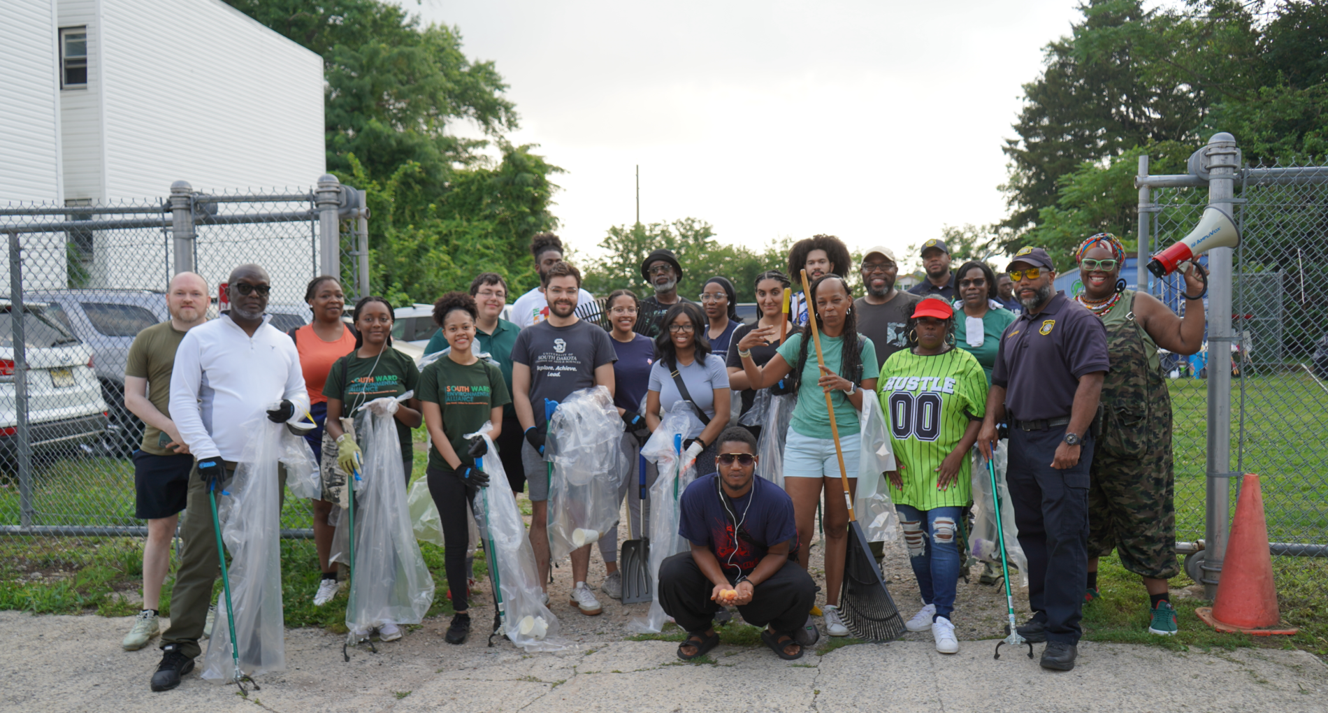 Group of volunteers posing after community cleanup.